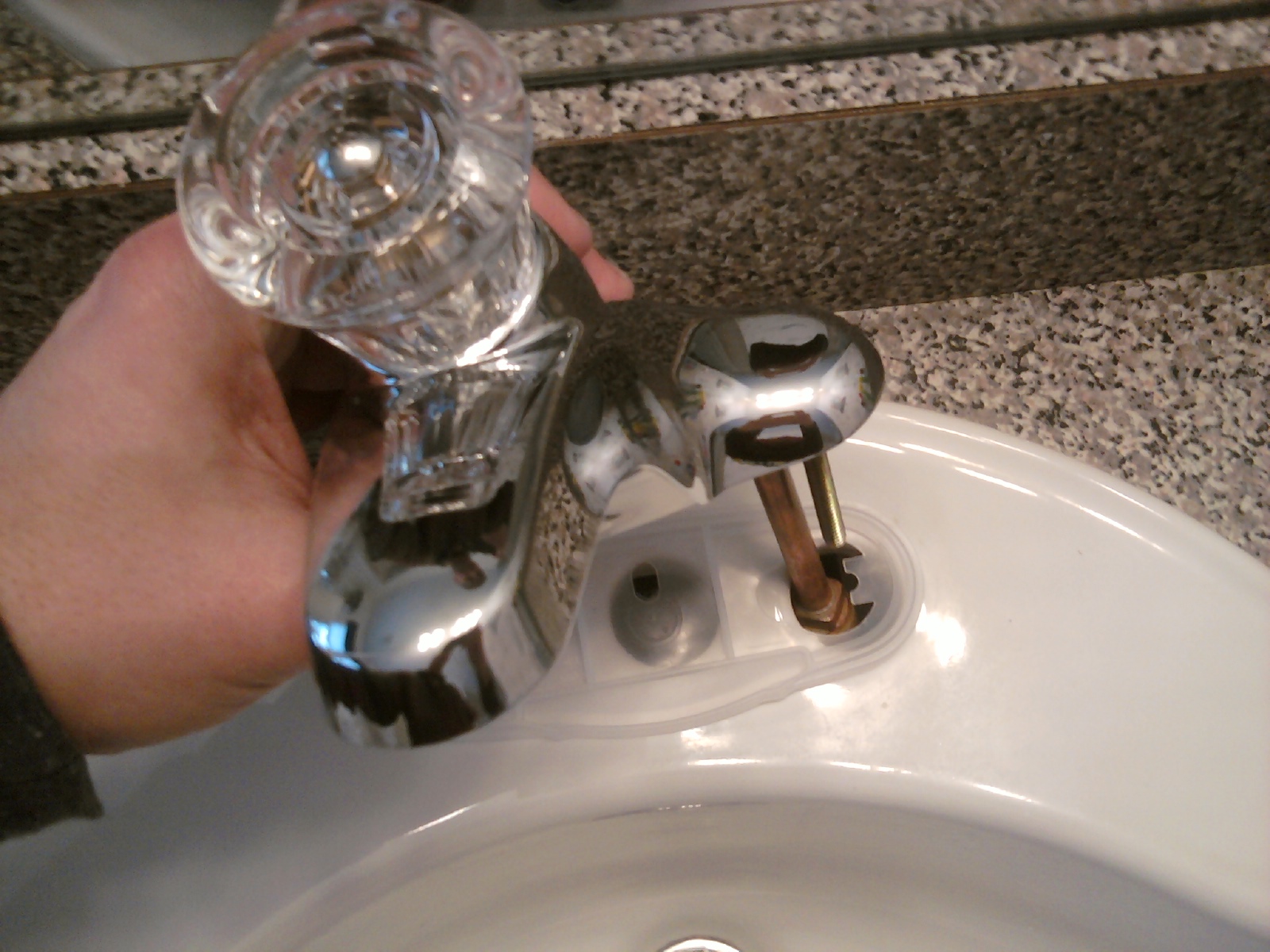 Positioning the New Bathroom Faucet for Installation