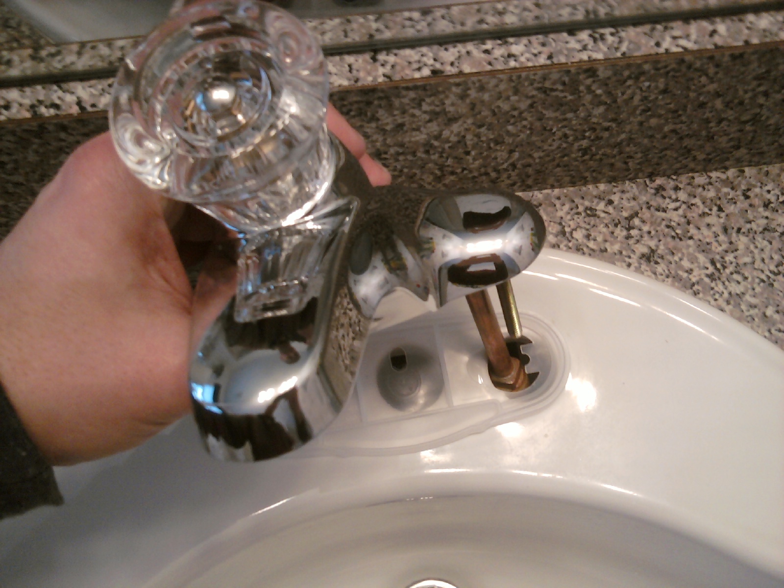 Positioning the New Faucet for Installation Positioning the New Bathroom Faucet for Installation