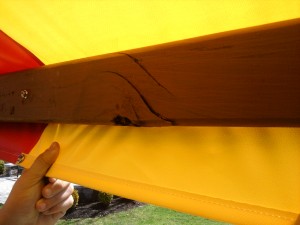 Damaged Redwood Swing Set Tarp Board