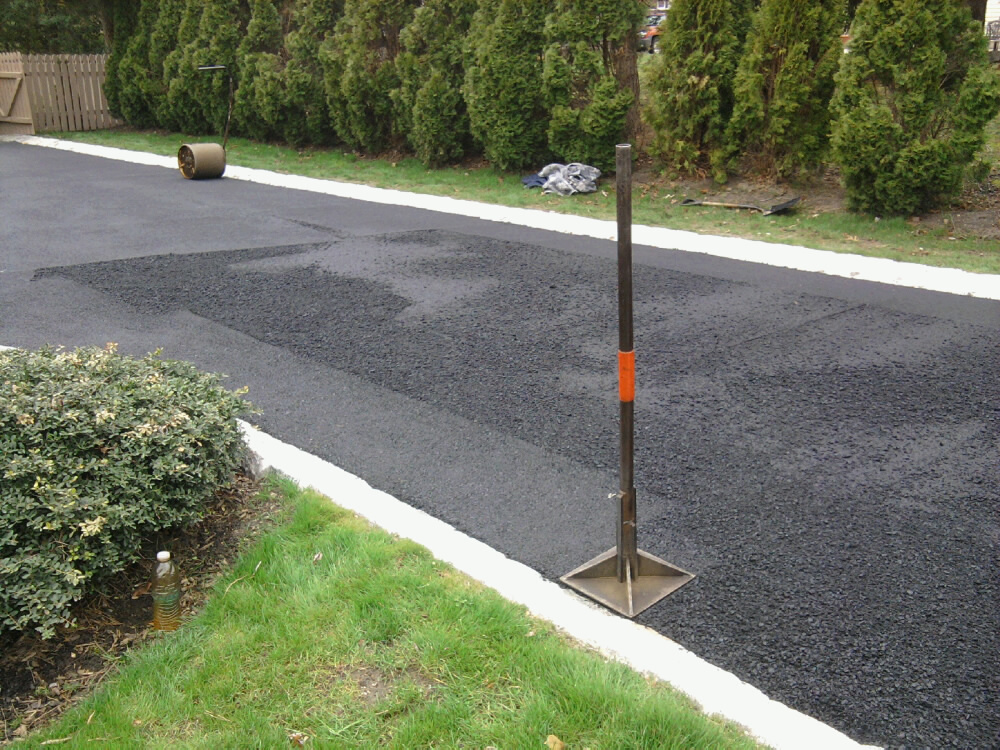 Tamping Asphalt Driveway