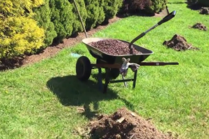 Barn Red Landscape Stone in Wheelbarrow