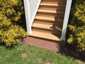 Deck Stairs and Barn Red Landscape Stone Golden Thread Cypress